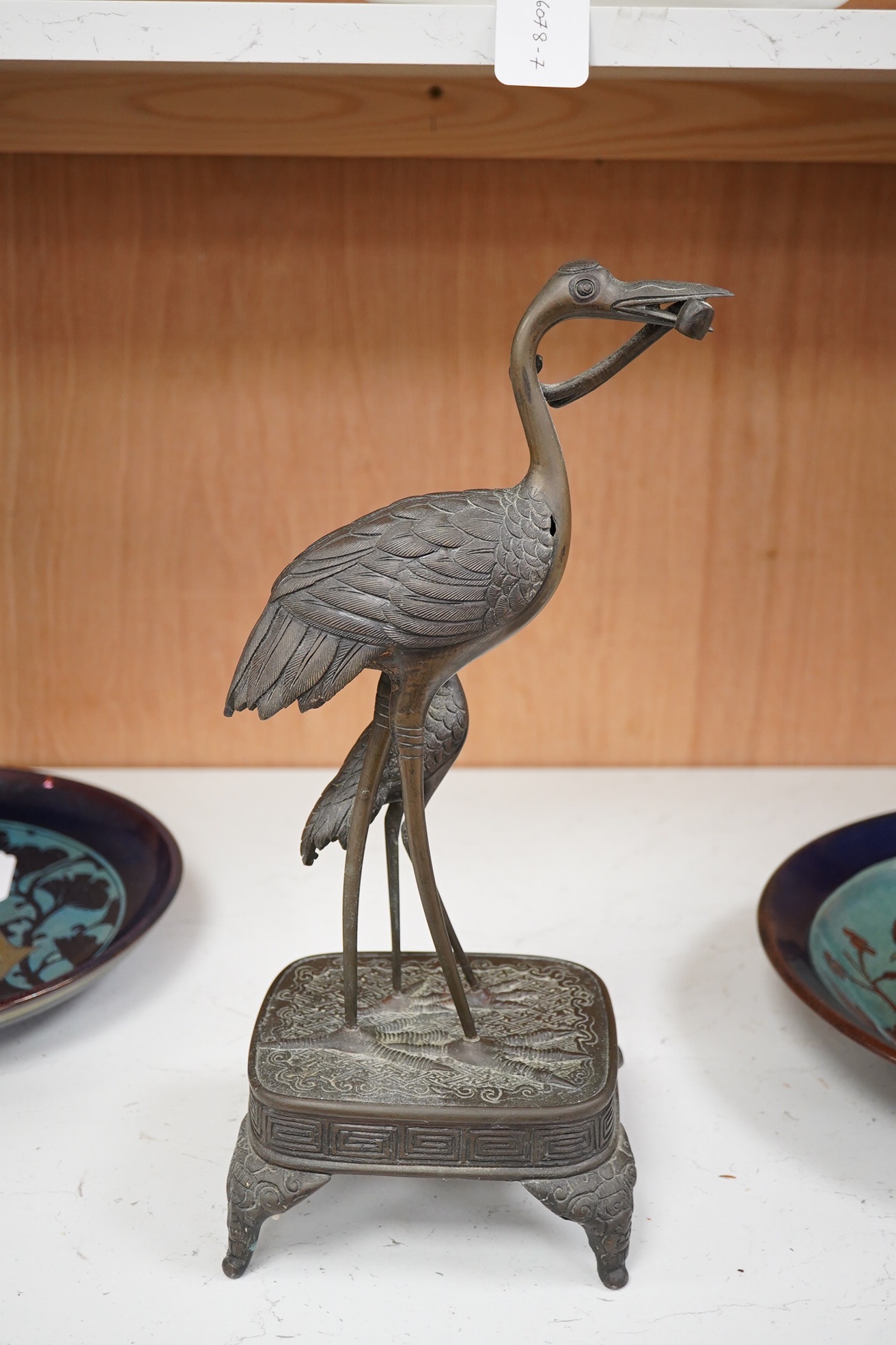 A Japanese bronze group of cranes, 19th century, 39cm high. Condition - section missing from prey in mouth